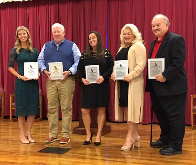 Melissa Boyd Miller, Mike Harper, Kristin Seckinger, Katie Rietkovich (represented by mother Patti Rietkovich) and Patrick Bolen (represented by father Tom Bolen) were inducted into the South Effingham Athletic Hall of Fame on Saturday. [DONALD HEATH/FOR EFFINGHAM NOW]