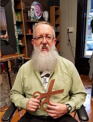 Brad Graham, Antrim Township administrator, received the award for 'Best Beard' in The Tide's 'Year Beard' challenge. Below, he opted for just a trim at the event marking the end of the fundraiser.