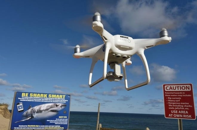 A new study suggests that drones can be effective in helping detect sharks in ocean waters. [Photo illustration by Steve Heaslip | Cape Cod Times file}