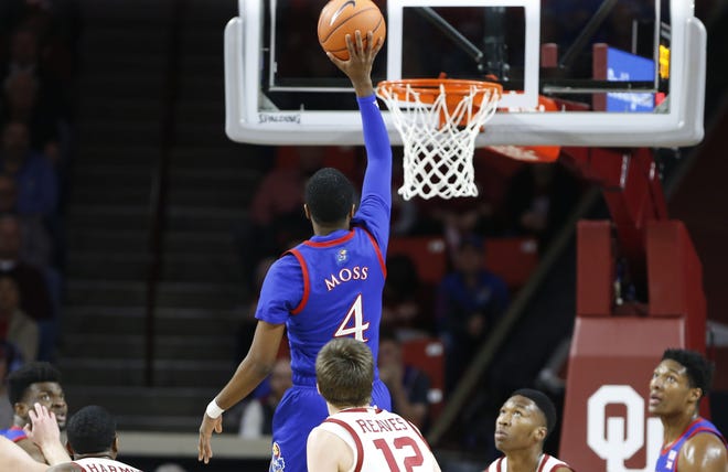 Kansas basketball guard Isaiah Moss attempts a shot during the No. 6-ranked Jayhawks' 66-52 victory over Oklahoma on Tuesday night in Norman, Okla. Moss, who started in place of injured sophomore Devon Dotson, finished with a game-high 20 points. [Alonzo Adams/USA TODAY Sports]
