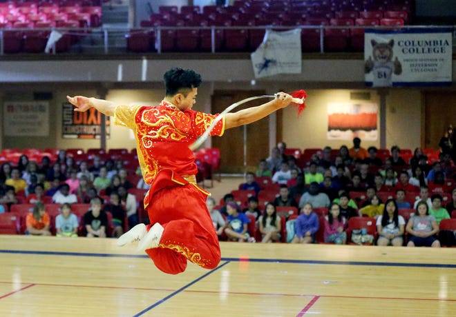 Kang Sun performs a martial arts routine in September 2016 at Jefferson Middle School as part of the MU Confucius Institute's five-year anniversary celebration. The University of Missouri is ending its contract with the institute because it cannot afford to provide Chinese-fluent personnel to supervise language classes in Columbia Public Schools. [Tim Tai/Tribune file photo]