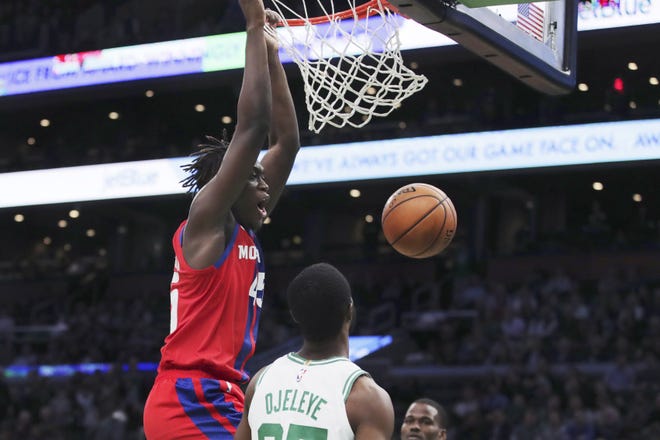 Detroit Pistons forward Sekou Doumbouya dunks over Boston Celtics forward Semi Ojeleye (37) during the second half of an NBA basketball game in Boston, Wednesday, Jan. 15, 2020. (AP Photo/Charles Krupa)