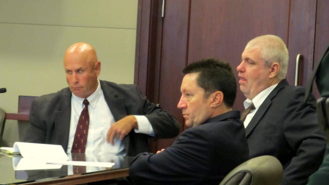 David Snelgrove, center, was overcome with emotion after a jury decided against recommending his execution Tuesday in the finale of his week-long death penalty trial. Snelgrove is flanked by defense attorneys Michel Nielsen, left, and Jeff Stone. [News-Journal/Matt Bruce]