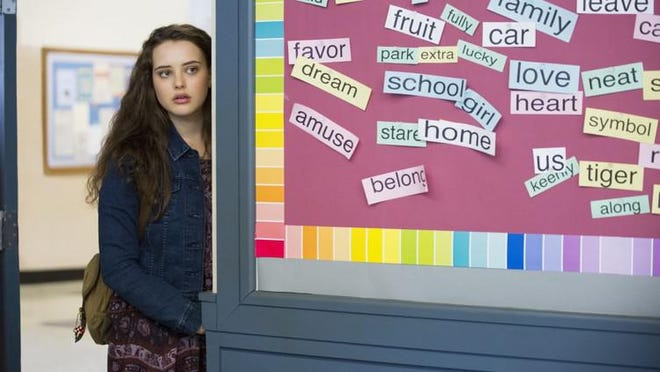 This image released by Netflix shows Katherine Langford in a scene from the series, "13 Reasons Why," about a teenager who commits suicide. The stomach-turning suicide scene has triggered criticism from some mental health advocates that it romanticizes suicide and even promoted many schools across the country to send warning letters to parents and guardians. The show’s creators are unapologetic, saying their frank depiction of teen life needs to be unflinching and raw. [Beth Dubber/Netflix via AP]