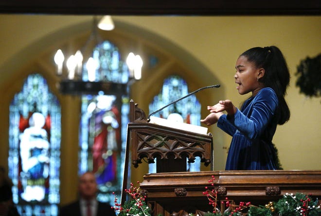 Nine-year-old Leah Noelle Jackson delivers her winning speech at the 35th annual Ohio Dr. Martin Luther King Jr. Commemorative Celebration at Trinity Episcopal Church Downtown on Thursday. [Fred Squillante/Dispatch]