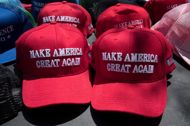 Make America Great Again hats ahead of a President Donald Trump campaign rally in Montoursville, Pa., Monday, May 20, 2019. [AP Photo/Matt Rourke]