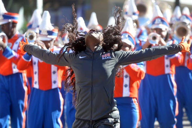 A dancer with the Savannah State University band performs in the Martin Luther King Jr. Day parade. (Steve Bisson/Savannah Morning News)
