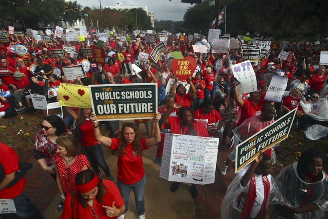 Thousands rally Monday during the Florida Education Association's Take on Tallahassee protest at the Old Capitol in Tallahassee. [AP Photo/Phil Sears]