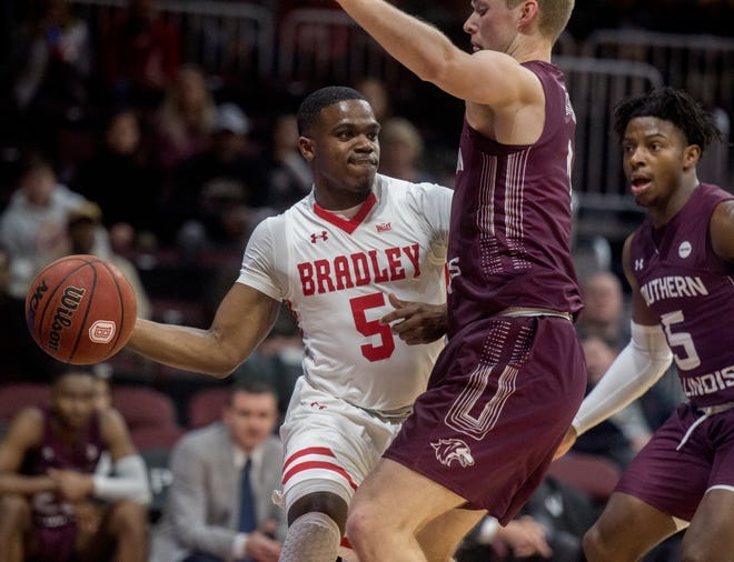 Bradley´s Darrell Brown, left, looks for an outlet around the Southern Illinois defense in the first half Saturday, Jan. 11, 2020 at Carver Arena. [MATT DAYHOFF/JOURNAL STAR]