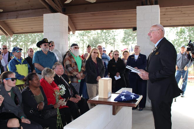 St. Johns Veterans Council Vice Chairman Ray Quinn leads the ceremony for John Meade, a homeless Army veteran who had a special connection with the residents of St. Augustine. [CHRISTEN KELLEY/THE RECORD]
