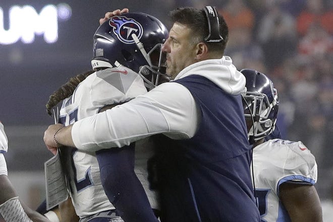 Titans coach Mike Vrabel, hugging star running back Derrick Henry after a touchdown against New England on Jan. 4, has won three Super Bowls as a player. [Steven Senne/The Associated Press]