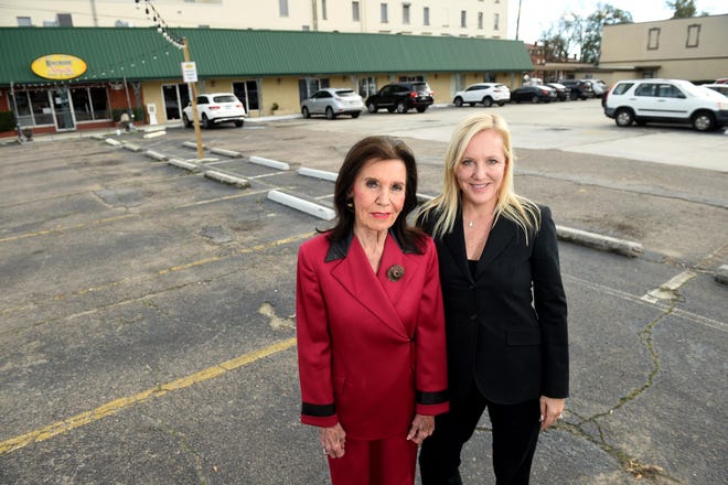 Nan Connell (left), the widow of longtime Georgia legislator Jack Connell, and daughter Andrea Gibbs stand at the family-owned property at 10th and Ellis streets that will become home to an upscale apartment community with ground-floor commercial space. [MICHAEL HOLAHAN/THE AUGUSTA CHRONICLE]