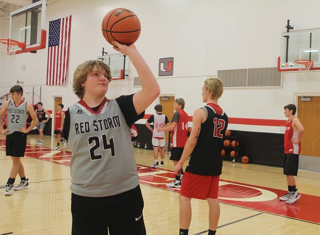 United High School junior Landon Conard preps to take a shot in last Monday's boys basketball practice in rural Monmouth. [BARRY MCNAMARA/For The Register-Mail]