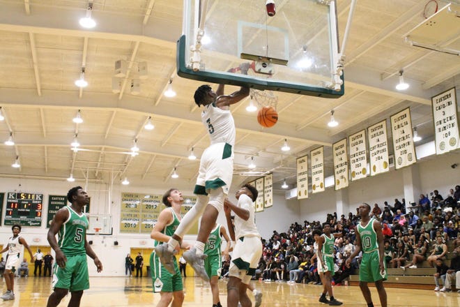 Kinston junior Dontrez Styles completes an alley-oop from Isaac Parson in the first quarter against North Lenoir. [Christopher Decker/Kinston Free Press]