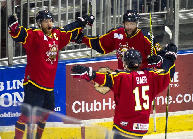 Peoria Rivermen captain Alec Hagaman, left, celebrates his goal 14 seconds after the opening faceoff of a Rivermen 3-2 shootout win over the Pensacola Ice Flyers on Sunday at Carver Arena. [DAVID ZALAZNIK/JOURNAL STAR]