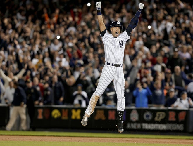The New York Yankees' Derek Jeter jumps after hitting the game-winning single against the Baltimore Orioles in the ninth inning of a game Setp. 25, 2014 in New York. Jeter, among 18 newcomers on the 2020 Hall of Fame ballot, got a near-unanimous vote in results announced Tuesday. [JULIE JACOBSON/AP FILE PHOTO]
