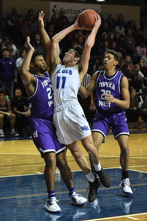 Washburn Rural junior Joe Berry (11) leads city boys in scoring with a 21.7-point average, helping lead the Junior Blues to a 7-1 start. [File photograph/The Capital-Journal]