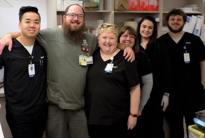 Mercy Fort Smith lab workers provide a behind-the-scenes service for patients. Co-workers include Anthony Nguyen, left, David Hudson with Arkansas Blood Institute, Dixie Parker, Beth Stransky, Hannah McGowin and Drew Davis. [Submitted photo]