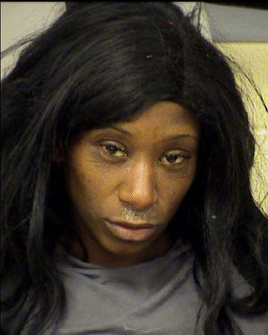 Kisa Taylor, 31, was arrested Tuesday after Austin police said she spit in an officer’s face and twerked half-naked while standing on top of a vehicle parked outside of a North Austin H-E-B. [AUSTIN POLICE DEPARTMENT]