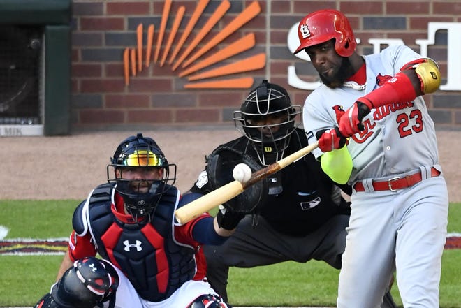 St. Louis Cardinals left fielder Marcell Ozuna (23) hits a single against the Atlanta Braves in the fourth inning during Game 2 of a best-of-five National League Division Series last fall. (AP Photo/Scott Cunningham)