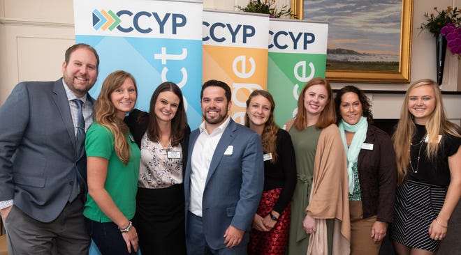 Organizers of the CCYP's 2019 Community Breakfast, from left, include Kevin Skrickis of DePaola Begg & Associates, Sarah Mason of Cape Cod Nail Company, Sara Kohls of Law Offices of Bruce A. Bierhans, Craig Orsi of Orsi & Co., Katrina Fryklund of Latham Centers, Charlotte Green of The Cooperative Bank of Cape Cod, Stacie Peugh of YMCA Cape Cod, and Jana Gailunas of Rent Sons. [PHOTO BY CHRISTINE HOCHKEPPEL/SALTY BROAD STUDIOS]