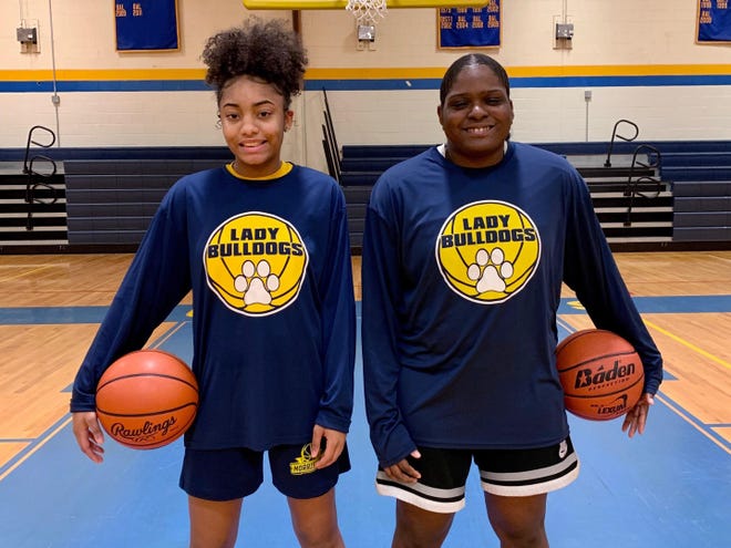 Morrisville seniors Dreyonna Graham, left, and Brielle Lindsey are making the most of the Bulldogs eight-player roster this winter. [CONTRIBUTED]