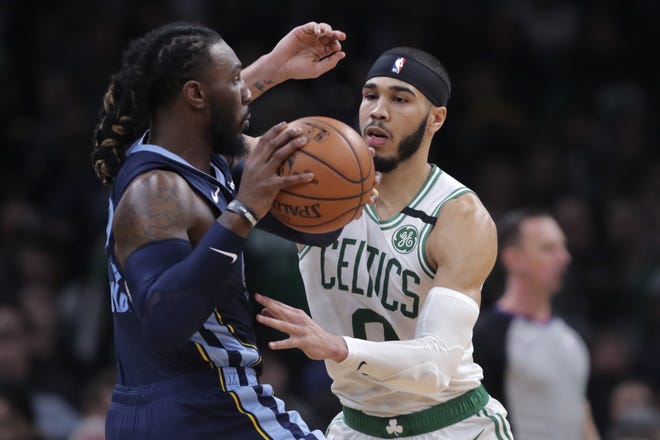 Boston forward Jayson Tatum pressures Memphis Grizzlies forward Jae Crowder during the second half Wednesday night at TD Garden. The former Celtic was held to three points but had six rebounds in the game. [AP / Charles Krupa]