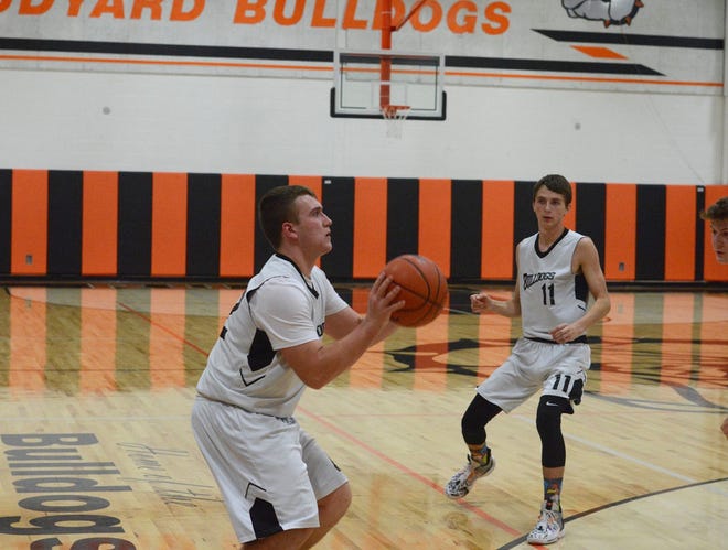 Rudyard's EJ Suggitt (42) gets ready to shoot a 3-pointers after collecting a pass from Nate Walling (11). The Bulldogs are ranked No. 2 in the U.P. Division 4 poll and No. 7 in the state poll this week [Courtesy of Stephanie Warner]