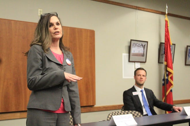 Sebastian County Circuit Judge Division VII candidate Diana Hewitt Ladd, left, speaks as candidate Sam Terry looks on at a candidates' panel at noon Tuesday in the Fort Smith Public Library. [MAX BRYAN/TIMES RECORD]