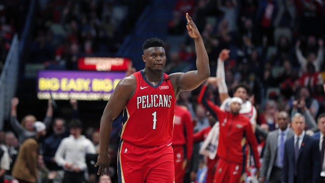 New Orleans Pelicans forward Zion Williamson reacts after making a 3-point shot in the second half against the San Antonio Spurs on Wednesday in New Orleans. The Spurs won 121-117. [Gerald Herbert/The Associated Press]