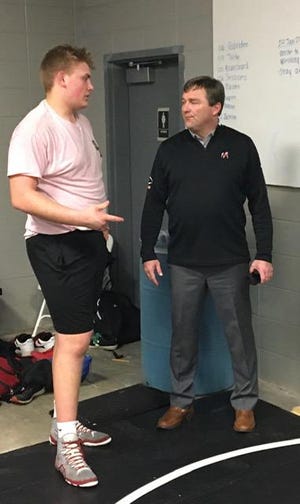 South Effingham’s Austin Blaske (left) and Georgia football coach Kirby Smart talk during the Mustangs’ wrestling practice on Thursday. Smart was on a whirlwind tour of the South, meeting with signees and recruiting. [DONALD HEATH/FOR THE SAVANNAH MORNING NEWS]