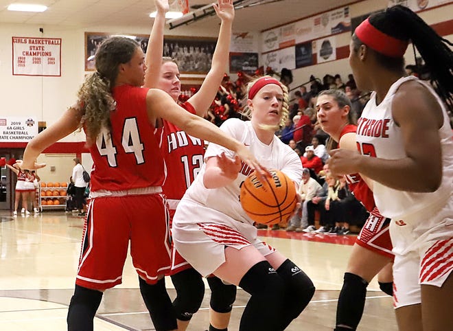 HoweþÄôs Zoe Nation, from left, guards Northside's Tracey Bershers as she attempts a pass to Kayla Flemming on Thursday, Dec. 12, 2019, during second quarter play at the Tournament of Champions in Kaundart Grizzly Field House. Howe will play Pocola in a semifinal game tonight in the LeFlore County Tournament. [TIMES RECORD FILE PHOTO]
