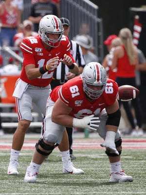 Gunnar Hoak, left, completed all six of his pass attempts as Ohio State's third-string quarterback this past season, with one touchdown. [Joshua A. Bickel/Dispatch]