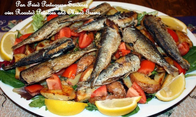 Pan-Fried Portuguese Sardines over Roasted Red Potatoes and Mixed Salad Greens. [Laura Tolbert]