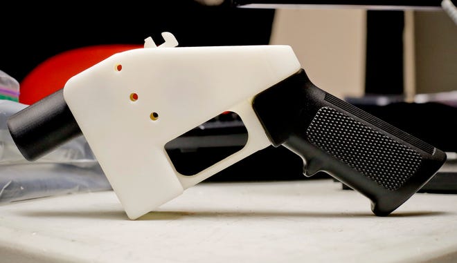 FILE- This Aug. 1, 2018 file photo, shows a 3D printed gun called the Liberator, in Austin, Texas. Attorneys general in 20 states and the District of Columbia have filed a lawsuit challenging a federal regulation that could allow blueprints for making guns on 3D printers to be posted on the internet.  New York Attorney General Tish James is helping to lead the coalition, which filed the lawsuit Thursday. (AP Photo/Eric Gay, File)