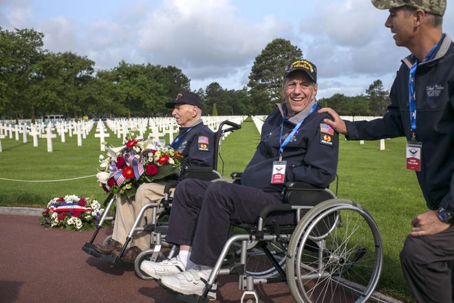 World War II veteran Pete Shaw, center, of North Canton, visited the Normandy American Cemetery in Colleville-sur-Mer, Normandy, in 2019 as France marked the 75th anniversary of the D-Day invasion on June 6, 1944. (AP Photo/Rafael Yaghobzadeh)