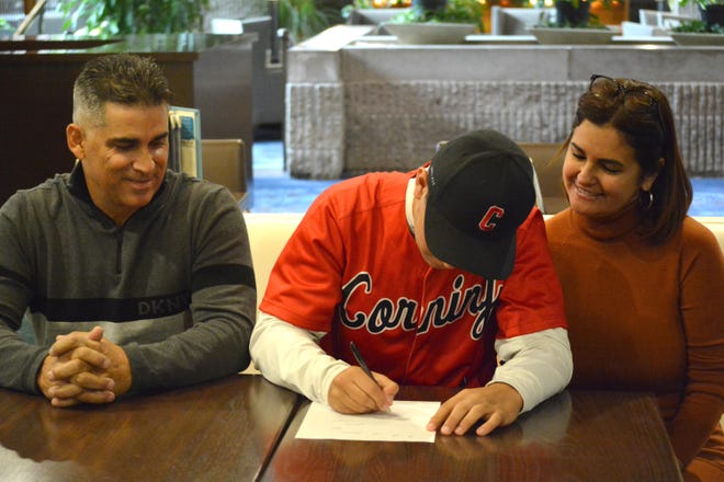 Gabriel Fonseca (middle) committed to play with Corning Community College Saturday. [TOM PASSMORE/THE LEADER]