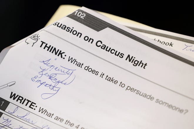 A question in a training booklet is seen during a caucus training meeting at the local headquarters for Democratic presidential candidate former South Bend, Ind., Mayor Pete Buttigieg in Ottumwa, Iowa. [CHARLIE NEIBERGALL/AP]