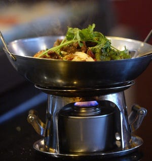 The Beef Hot Pot offers a lively diversion at the Tasty Bowl in Summit Township. [GREG WOHLFORD FILE PHOTO/ERIE TIMES-NEWS]