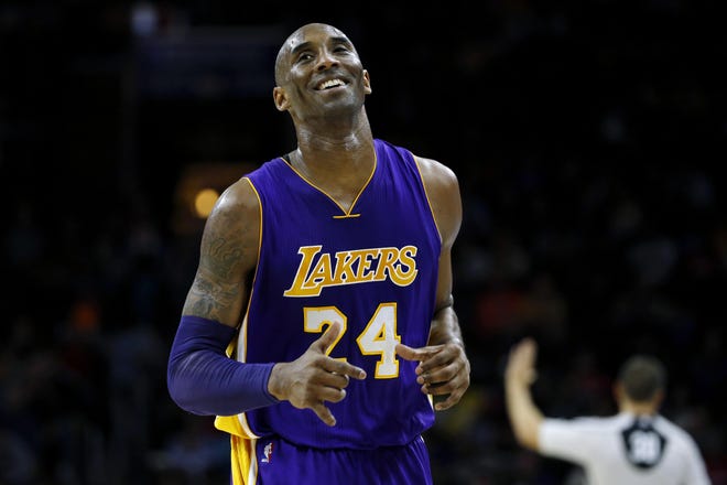 In this Dec. 1, 2015 file photo Los Angeles Lakers' Kobe Bryant smiles as he jogs to the bench during the first half of an NBA basketball game against the Philadelphia 76ers in Philadelphia. The Retired NBA superstar has died in helicopter crash in Southern California, Sunday, Jan. 26, 2020. [AP PHOTO / MATT SLOCUM]