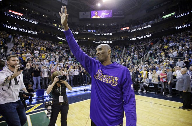 Los Angeles Lakers forward Kobe Bryant waves to the fans after his introduction before the start of a game against the Utah Jazz on March 28, 2016 in Salt Lake City. Bryant, the 18-time NBA All-Star who won five championships and became one of the greatest basketball players of his generation during a 20-year career with the Los Angeles Lakers, died in a helicopter crash Sunday. He was 41. [RICK BOWMER/AP FILE PHOTO]