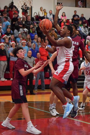 Shawnee Heights senior Marquis Barksdale scored a game-high 18 points in Saturday's 63-48 loss to Manhattan in the third-place game of the Tournament of Champions at Dodge City. [File photograph/The Capital-Journal]