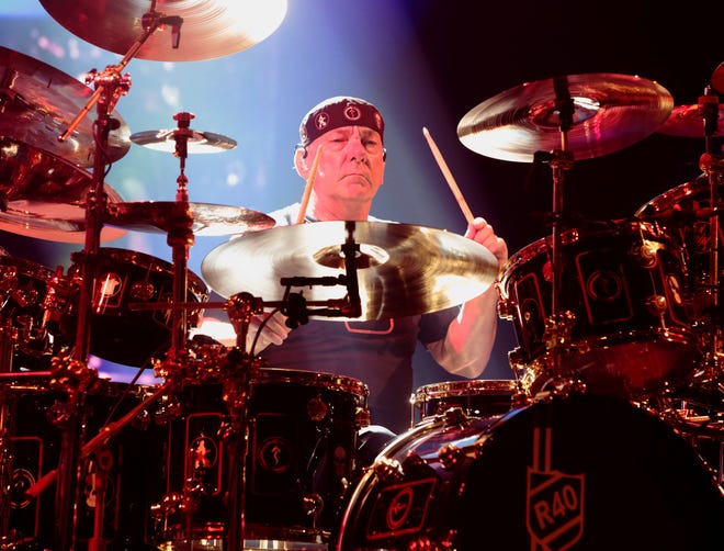 FILE - This June 25, 2015 file photo shows Neil Peart of the band Rush performing in concert during their R40 Live: 40th Anniversary Tour in Philadelphia. Peart, the renowned drummer and lyricist from the band Rush, has died. His rep Elliot Mintz said in a statement Friday that he died at his home Tuesday, Jan. 7, 2020 in Santa Monica, Calif. He was 67. (Photo by Owen Sweeney/Invision/AP, File)