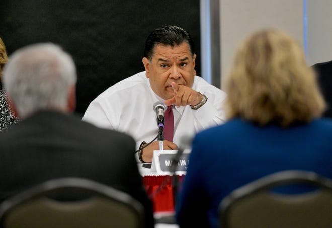 In this file photo, Illinois State Sen. Martin Sandoval, D-Chicago, quizzes educational institution leaders during a hearing last April at Bradley University. Federal prosecutors levied two charges against Sandoval on Monday in an ongoing corruption probe. [DAVID ZALAZNIK/JOURNAL STAR FILE PHOTO]
