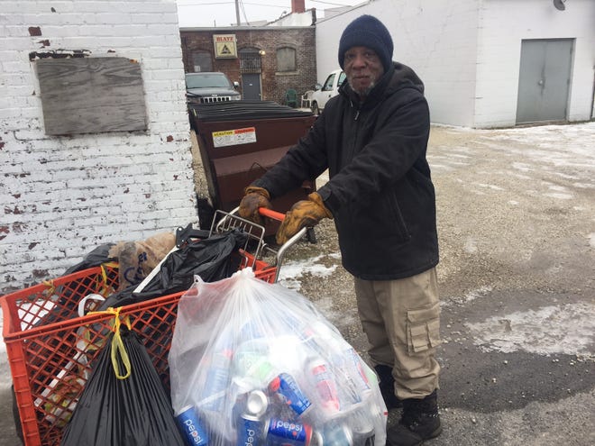 Billy Flora pauses Monday, Jan. 27, 2020 in an alley behind Garden Gate Tap, 1313 W. Garden St. For 30 years, Flora has collected cans and other metal in South Peoria -- sometimes from old friends, sometimes from tavern Dumpsters. [PHIL LUCIANO/JOURNAL STAR]