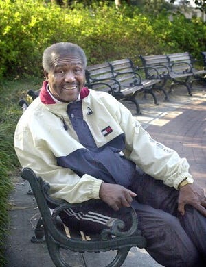 Jim Golden rests on a park bench after a brisk walk around Forsyth Park. [Steve Bisson/for savannahnow.com]