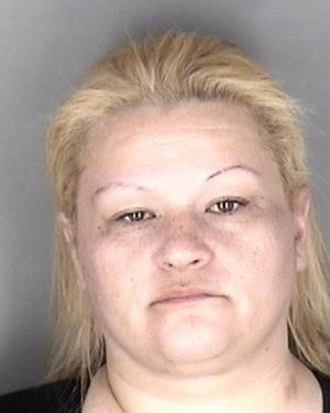 Janna L. Marshno, 33, was arrested Monday in connection with identity theft, forgery, burglary, theft, criminal damage and shoplifting. [Shawnee County Jail]