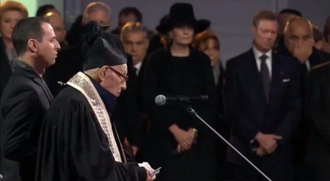 Cantor David Wisnia, 93, of Levittown, sings at the ceremony marking the 75th anniversary of the liberation of the death camp at Auschwitz in Poland Monday. With him is his grandson, Avi Wisnia, of Philadelphia and formerly of Lower Makefield. [CONTRIBUTED]