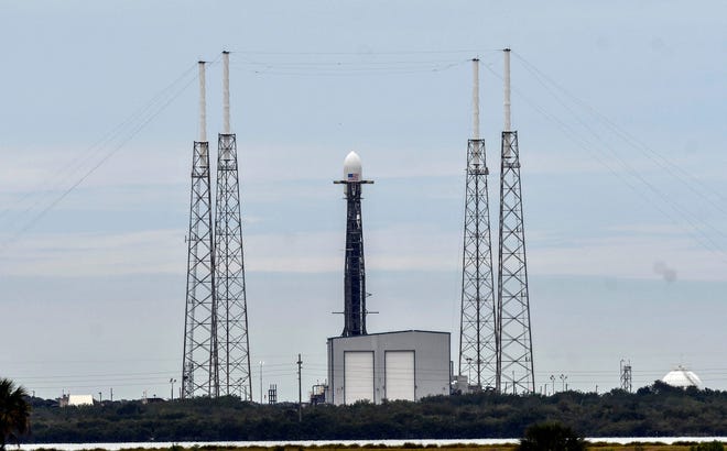 SpaceX's Falcon 9 rocket sits on the pad at Cape Canaveral Air Force Station's Launch Complex 40 on Monday. The launch attempt was scrubbed due to powerful upper-level winds. [Craig Bailey/FLORIDA TODAY]