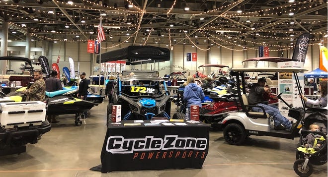 People check out boats and off-road vehicles near Topeka's Cycle Zone Powersports booth at the Topeka Boat & Outdoors Show. [Submitted]